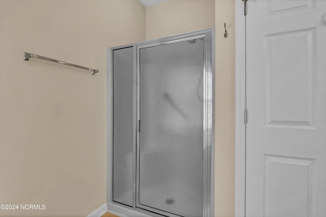 full bathroom with a shower stall