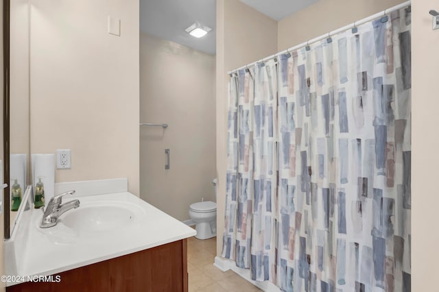 bathroom with curtained shower, tile patterned flooring, vanity, and toilet