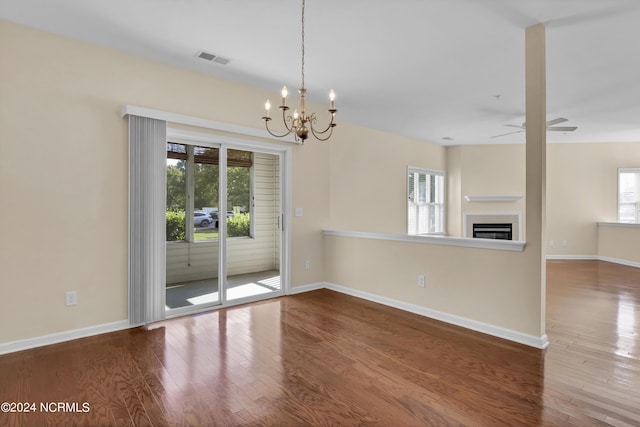 interior space with visible vents, baseboards, and wood finished floors