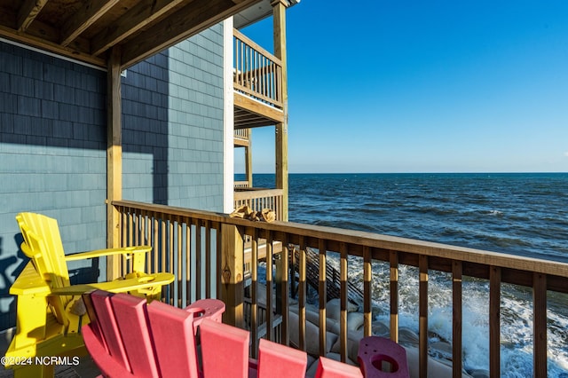 balcony featuring a water view