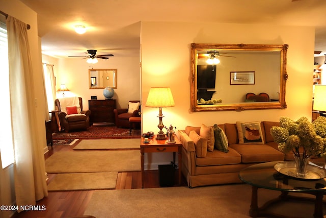 living room with ceiling fan and wood-type flooring