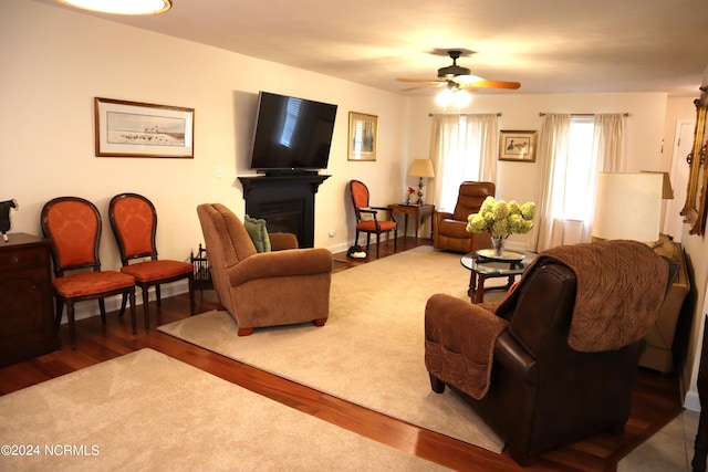 living room featuring hardwood / wood-style flooring and ceiling fan