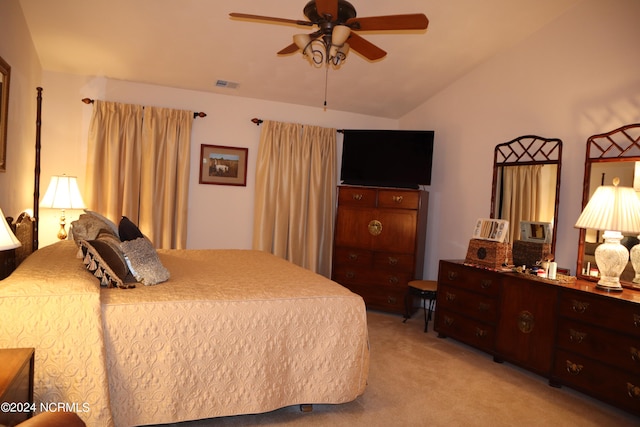 carpeted bedroom featuring lofted ceiling and ceiling fan