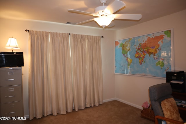 home office with carpet floors and ceiling fan