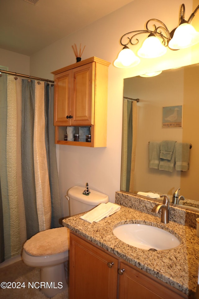 bathroom with vanity, toilet, and a shower with shower curtain