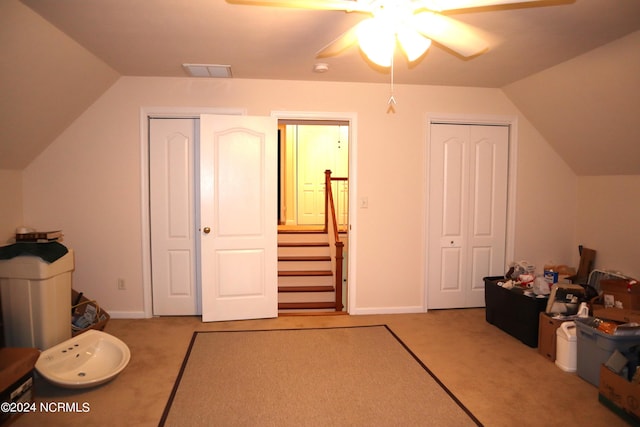 bonus room featuring ceiling fan, carpet floors, and vaulted ceiling