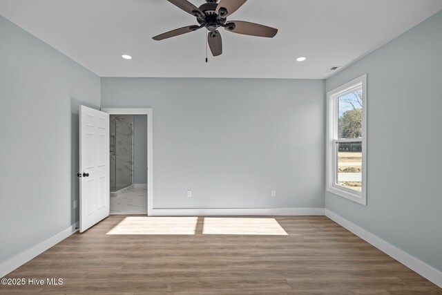 unfurnished room with ceiling fan and light hardwood / wood-style flooring