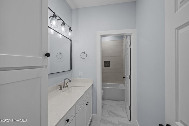 full bathroom featuring vanity, toilet, and tiled shower / bath combo