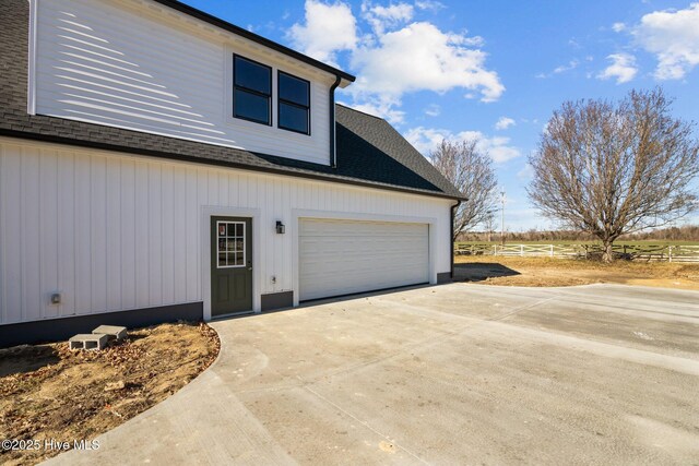 view of side of property featuring a garage