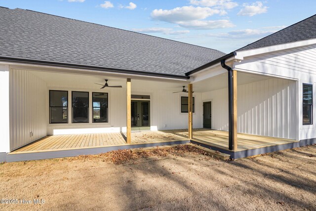 rear view of house with ceiling fan and french doors