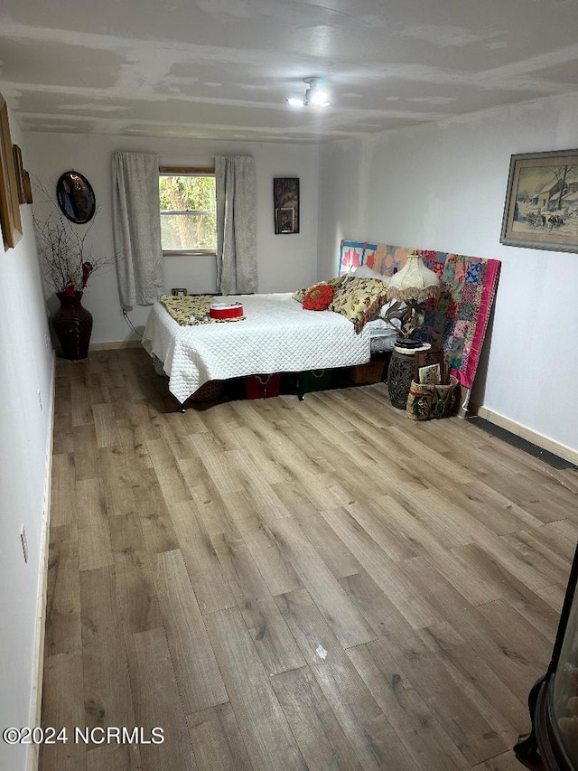 bedroom featuring light hardwood / wood-style floors