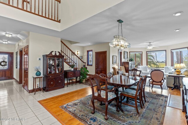 114 SW 21st St, Oak Island, NC 28465 - dining area featuring recessed lighting, light tile patterned flooring, a ceiling fan, stairs, and baseboards