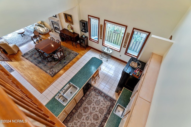 114 SW 21st St, Oak Island, NC 28465 - living room with a high ceiling, tile patterned floors, and baseboards