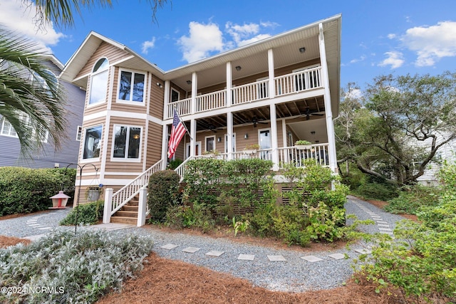 view of front of house featuring a balcony