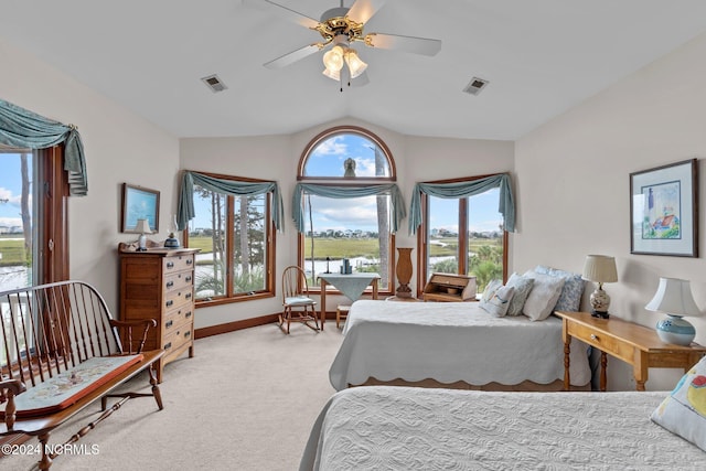 bedroom featuring light carpet, ceiling fan, and vaulted ceiling