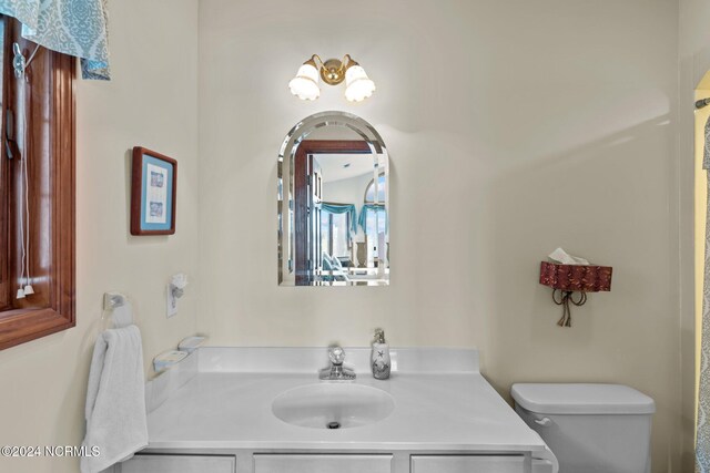 114 SW 21st St, Oak Island, NC 28465 - bathroom featuring toilet and vanity