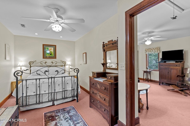 114 SW 21st St, Oak Island, NC 28465 - carpeted bedroom featuring visible vents, a ceiling fan, and baseboards