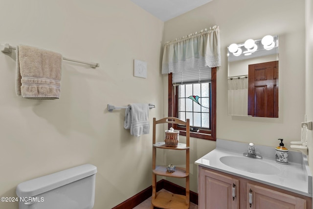 114 SW 21st St, Oak Island, NC 28465 - full bathroom with baseboards, a shower with shower curtain, toilet, and vanity