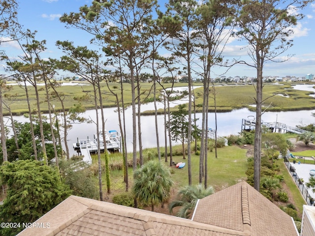 114 SW 21st St, Oak Island, NC 28465 - property view of water featuring a dock