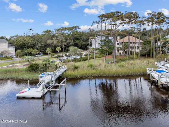 114 SW 21st St, Oak Island, NC 28465 - view of dock with a water view