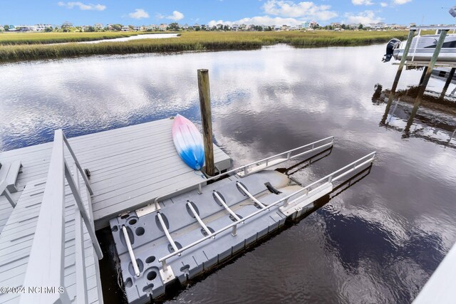 114 SW 21st St, Oak Island, NC 28465 - view of dock featuring a water view