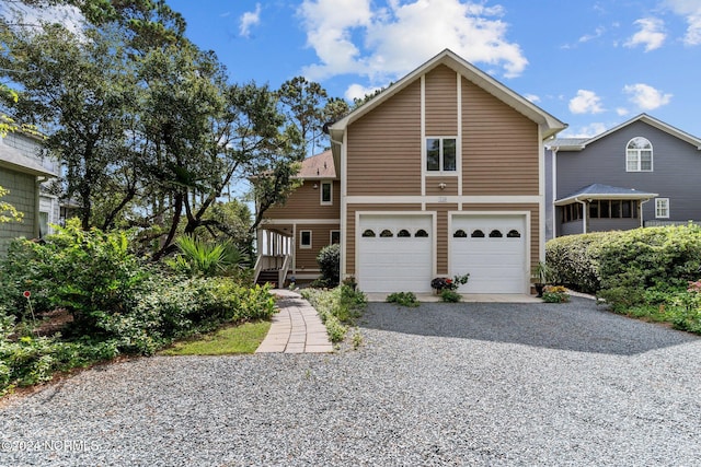 114 SW 21st St, Oak Island, NC 28465 - traditional-style house featuring driveway and an attached garage