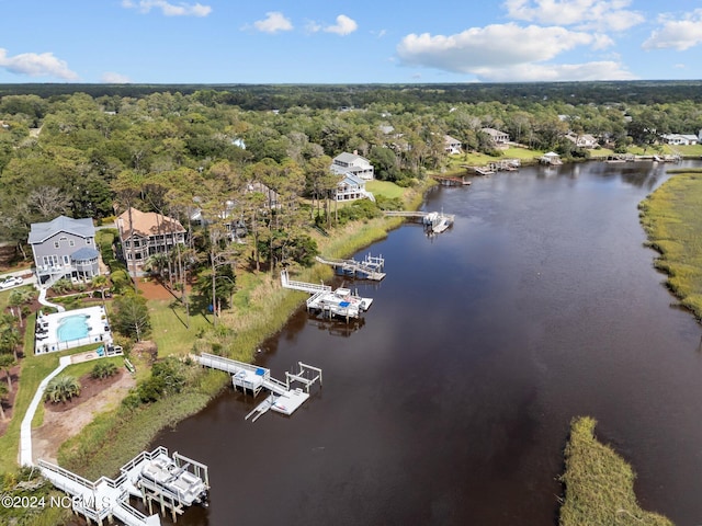 114 SW 21st St, Oak Island, NC 28465 - birds eye view of property with a water view and a wooded view