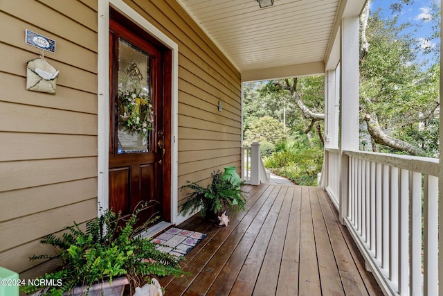 114 SW 21st St, Oak Island, NC 28465 - wooden terrace with a porch