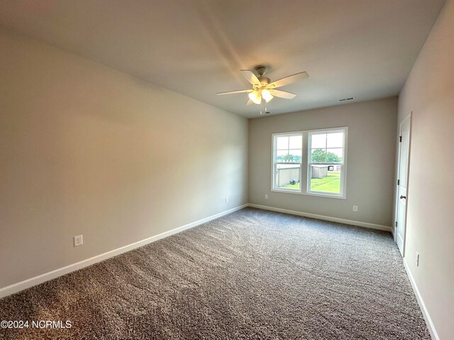 unfurnished room with carpet floors and ceiling fan