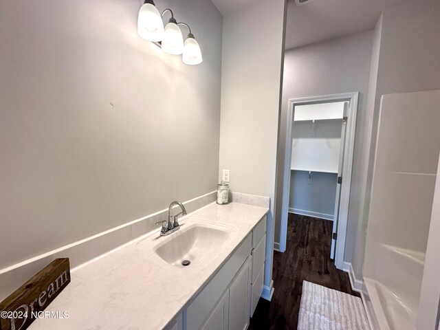 bathroom featuring vanity and hardwood / wood-style floors