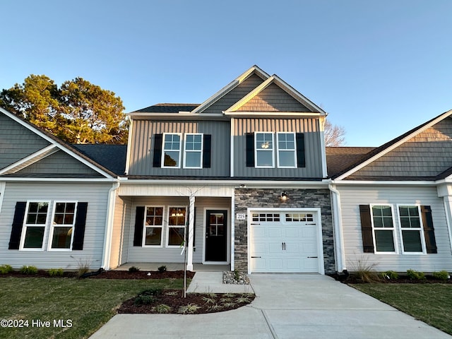 craftsman-style home featuring a garage and covered porch