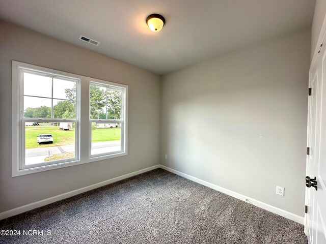 spare room featuring carpet