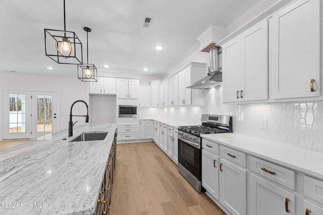 kitchen featuring white cabinetry and appliances with stainless steel finishes