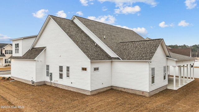 rear view of property featuring a patio