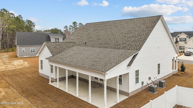 exterior space with a patio area and central AC