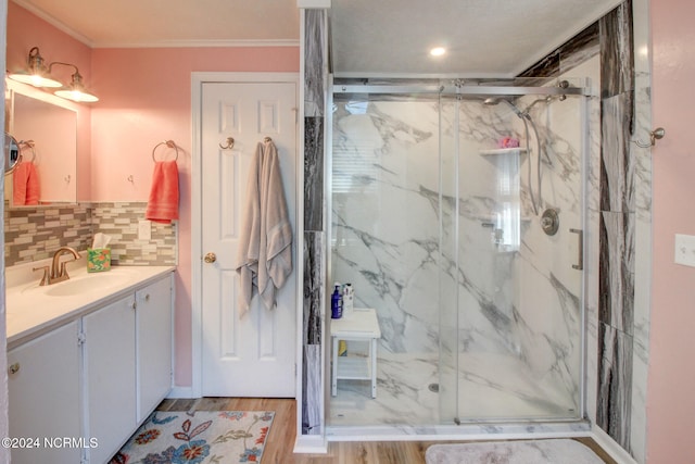 bathroom featuring vanity, walk in shower, and wood-type flooring