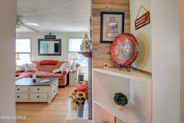 interior space featuring a textured ceiling and light hardwood / wood-style floors