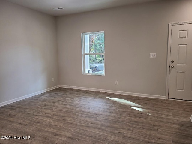 empty room featuring dark hardwood / wood-style floors