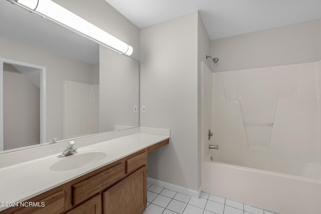 unfurnished bedroom featuring sink, light wood-type flooring, ensuite bath, and a closet