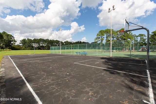 view of sport court featuring tennis court