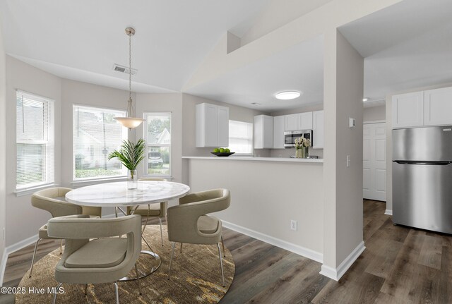 unfurnished room with wood-type flooring, high vaulted ceiling, and ceiling fan