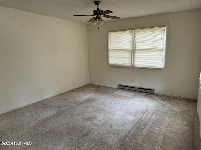 carpeted empty room featuring a textured ceiling, ceiling fan, and a baseboard heating unit