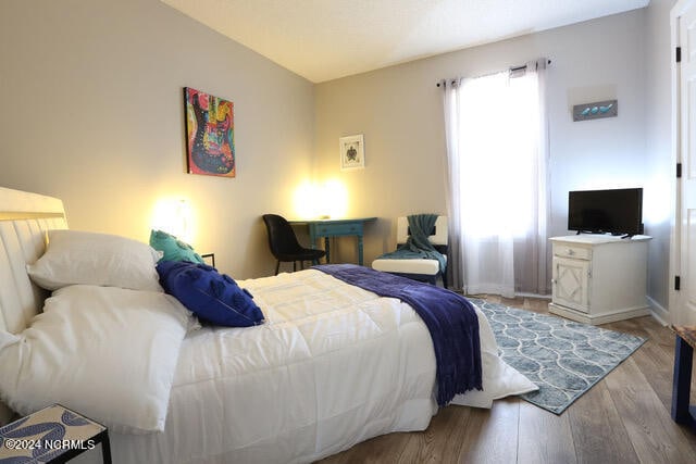 bedroom with light hardwood / wood-style flooring