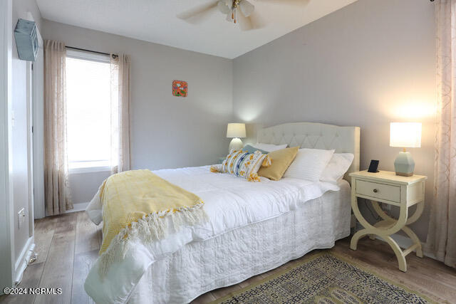 bedroom featuring light wood-type flooring and ceiling fan