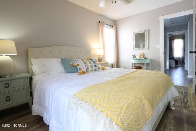 bedroom featuring dark hardwood / wood-style flooring