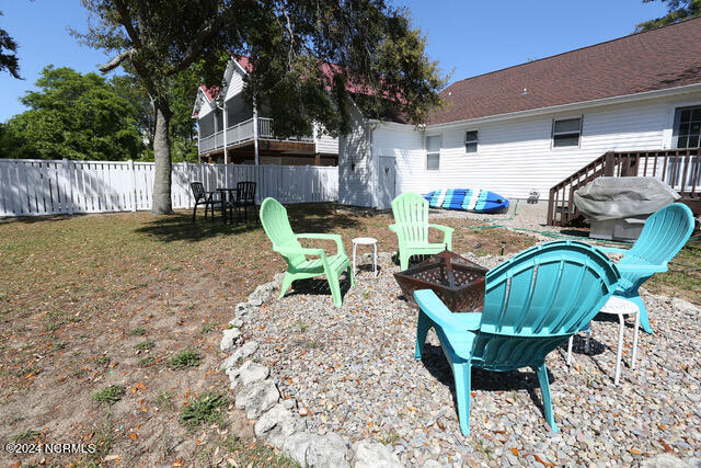 view of yard with a fire pit