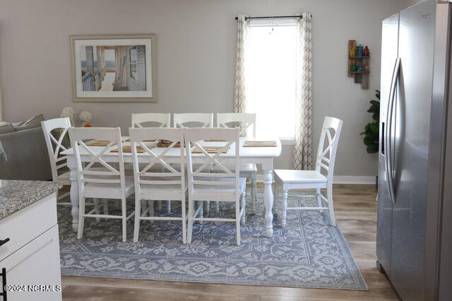 dining room featuring wood-type flooring