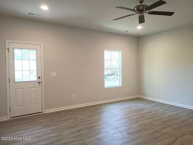 entrance foyer featuring ceiling fan and dark wood-type flooring