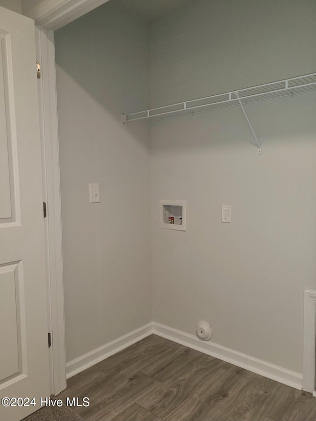 washroom with hookup for a washing machine and dark wood-type flooring