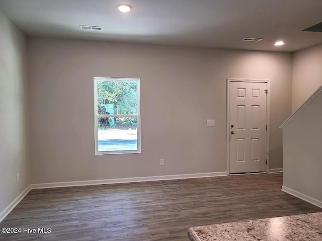 interior space with dark hardwood / wood-style flooring